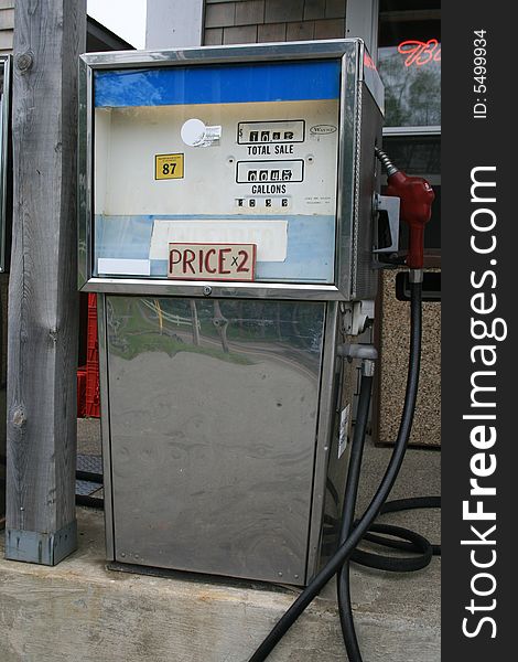 Antiquated gasoline pump, at a small country store, showing lack of technology by having to double the price actually showing. Antiquated gasoline pump, at a small country store, showing lack of technology by having to double the price actually showing