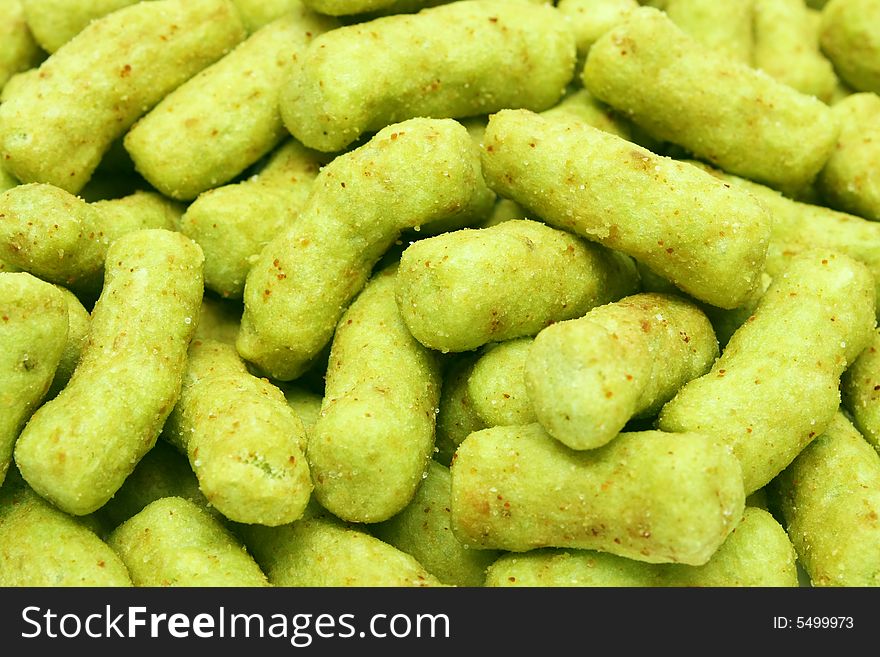 A pile of green peas snack as background.