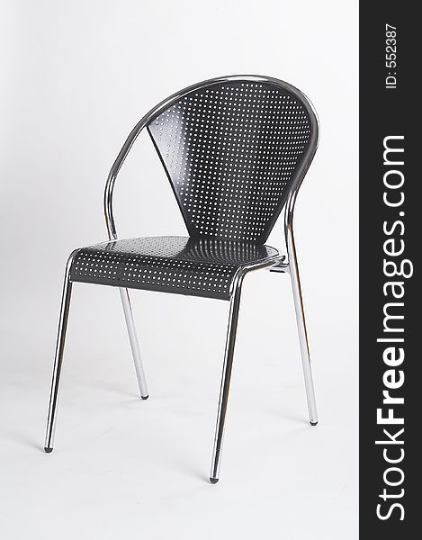 Black metal chair on white background - schwarzer Metallstuhl vor weissem Hintergrund. Black metal chair on white background - schwarzer Metallstuhl vor weissem Hintergrund