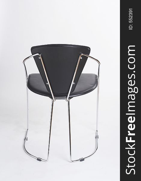 Black metal chair on white background - schwarzer Metallstuhl vor weissem Hintergrund. Black metal chair on white background - schwarzer Metallstuhl vor weissem Hintergrund