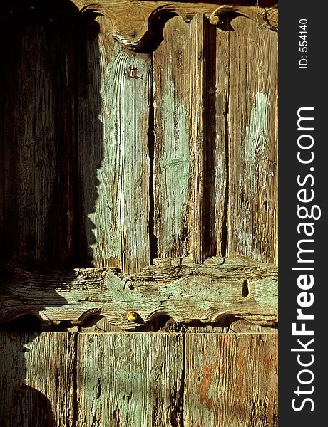 Old wooden door in Monregrazie, Italy