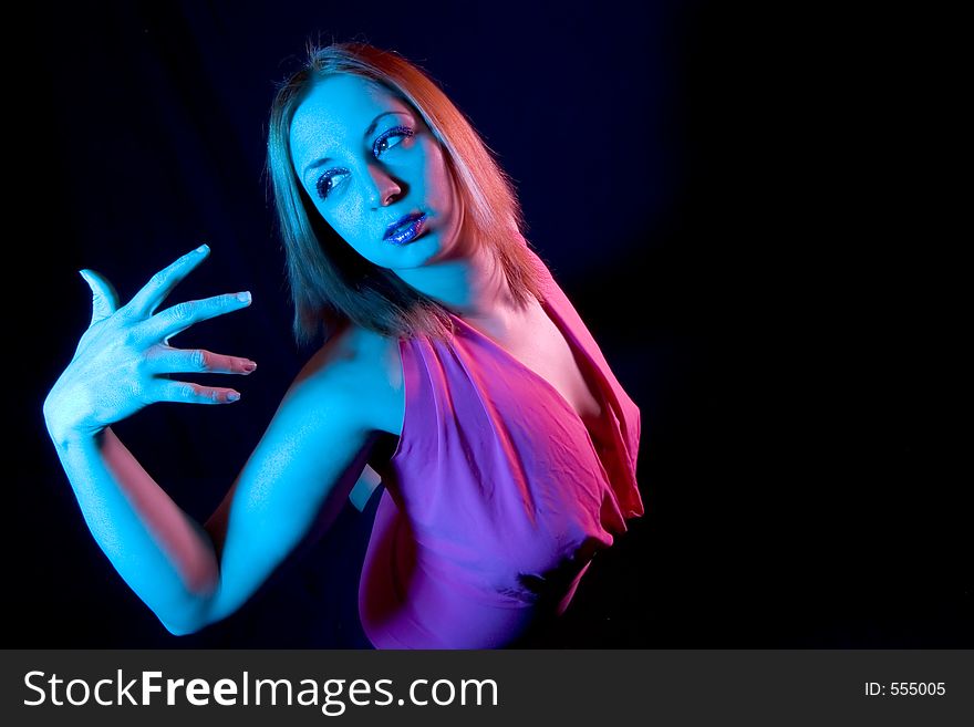 Woman in Pose shot with blue and pink filters and a wide angle lens