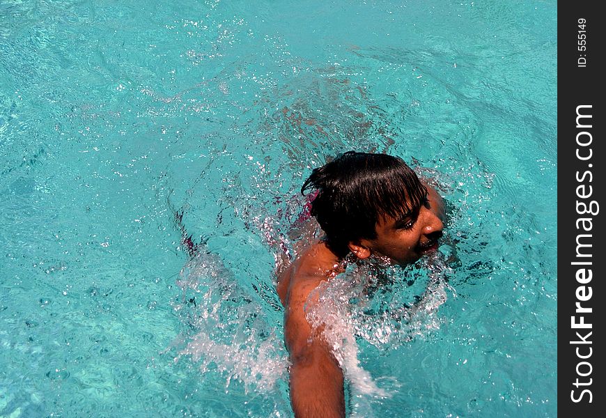 A swimmer reaching the post. A swimmer reaching the post.