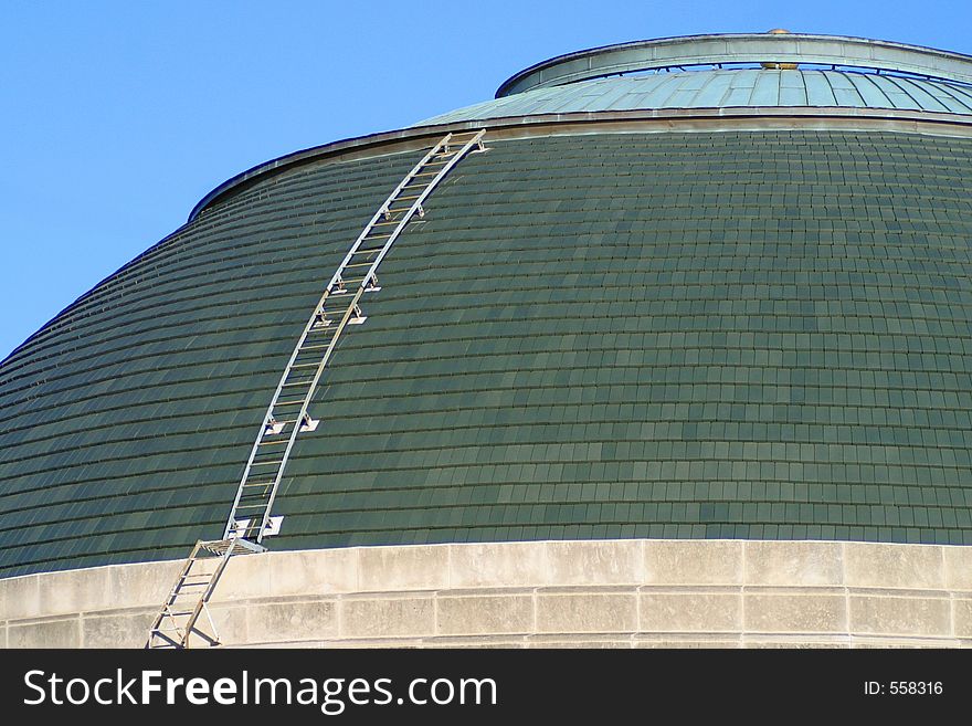 One of the many domed rooftops in the Chicago area with a ladder running up the side. One of the many domed rooftops in the Chicago area with a ladder running up the side.