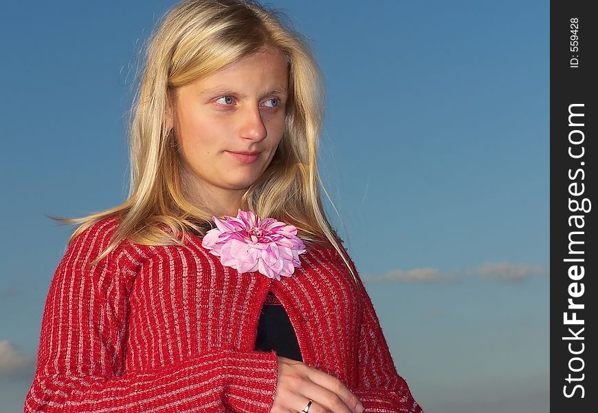 Blond Woman With A Flower