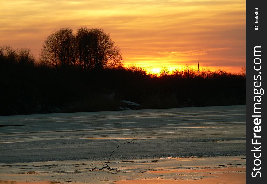 Sunset on a frozen lake