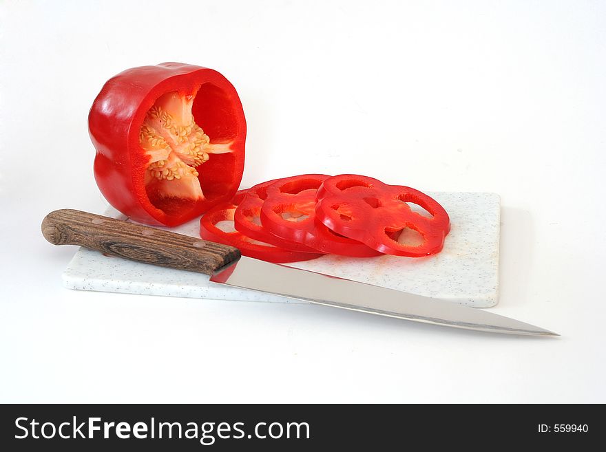 Red pepper with knife