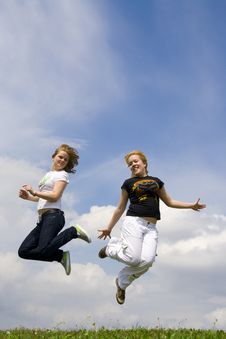 The Two Happy Jumping Girls Royalty Free Stock Photo The Two Happy Jumping Girls Royalty Free Stock Photo