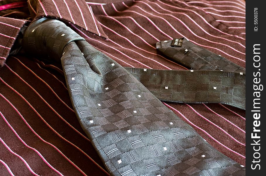 A corporate attire with complete neck tie. A corporate attire with complete neck tie