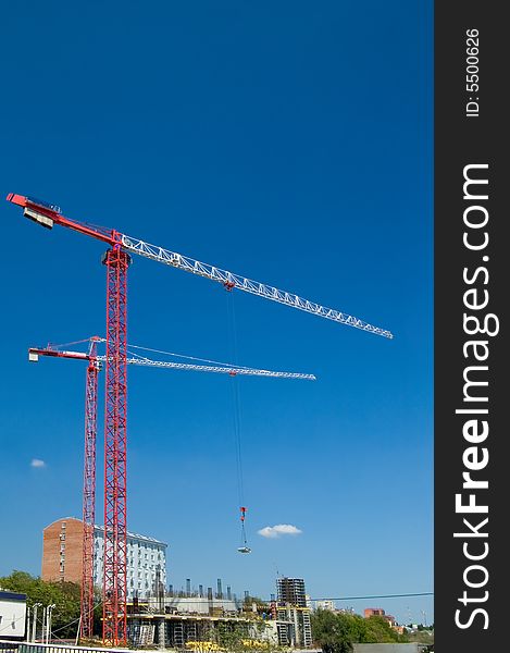 Elevating cranes on building of the elite house