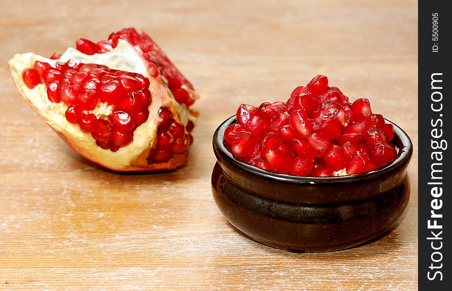 Broken ripe pomegranate fruit and seeds