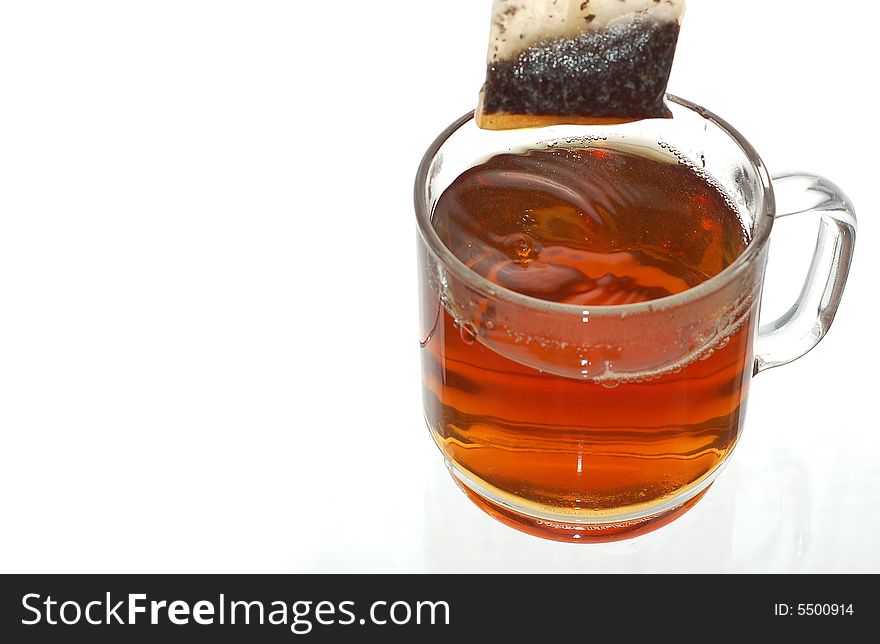 Transparent cup of tea with tea bag