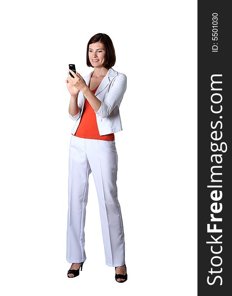Business the woman in white clothes costing looks at a mobile phone. Business the woman in white clothes costing looks at a mobile phone