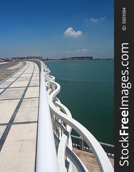 White railing of a new arcing bridge. White railing of a new arcing bridge