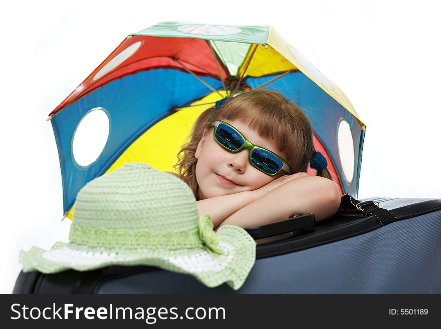 A girl with umbrella on a valise. A girl with umbrella on a valise
