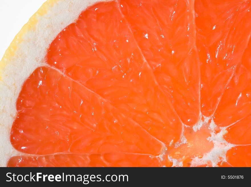 Fresh juicy grapefruit. Close up on a white background. Fresh juicy grapefruit. Close up on a white background.