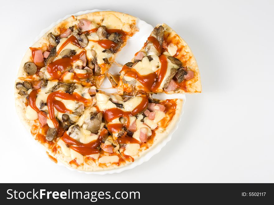 Appetizing pizza with ketchup on a dish