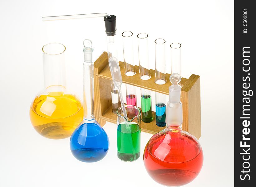 Various colorful glass laboratory ware on a white background. Various colorful glass laboratory ware on a white background