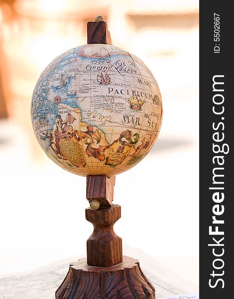Old globe on wooden display stand