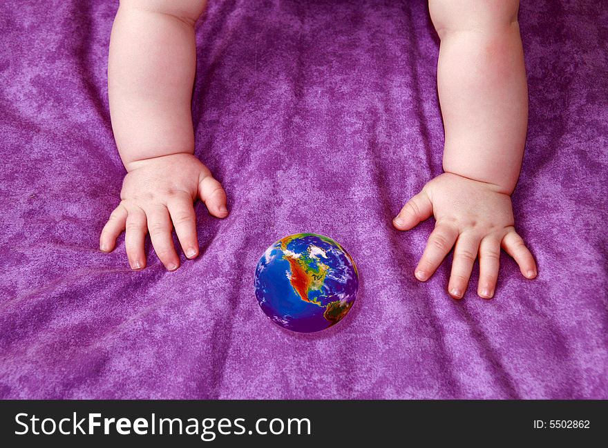 Globe in handles of the kid - all in its arms. Globe in handles of the kid - all in its arms.