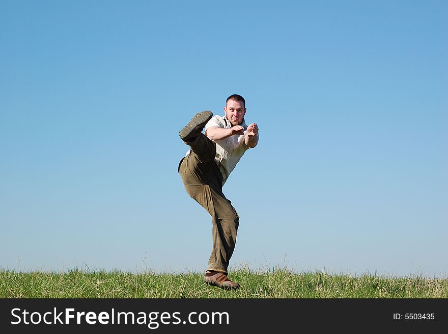 Active man on green meadow. Active man on green meadow