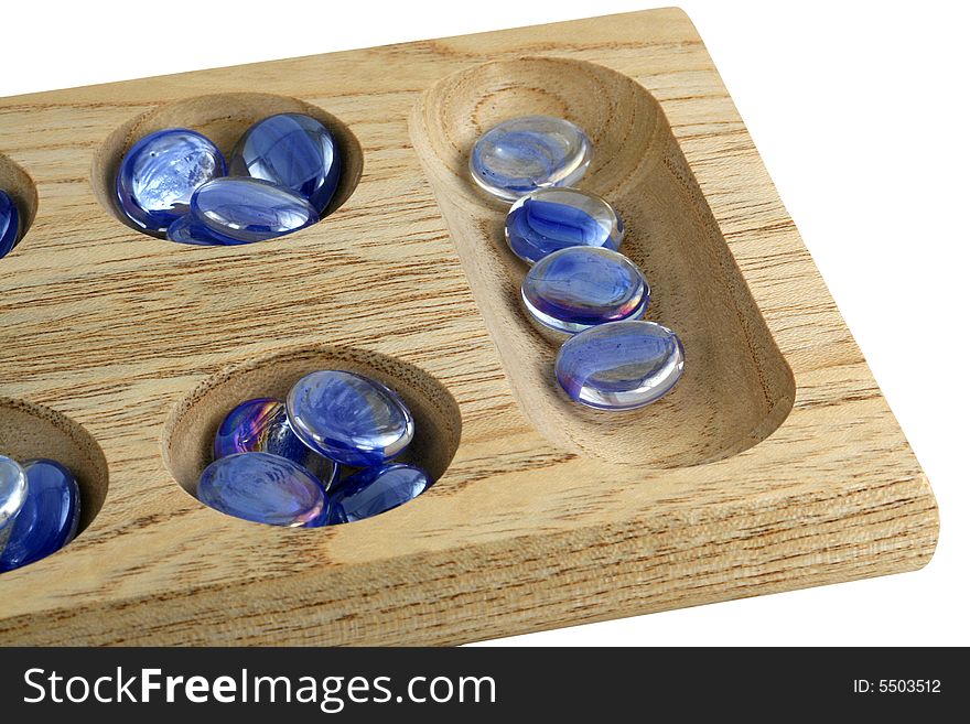 A Wooden mancala game with blue stones