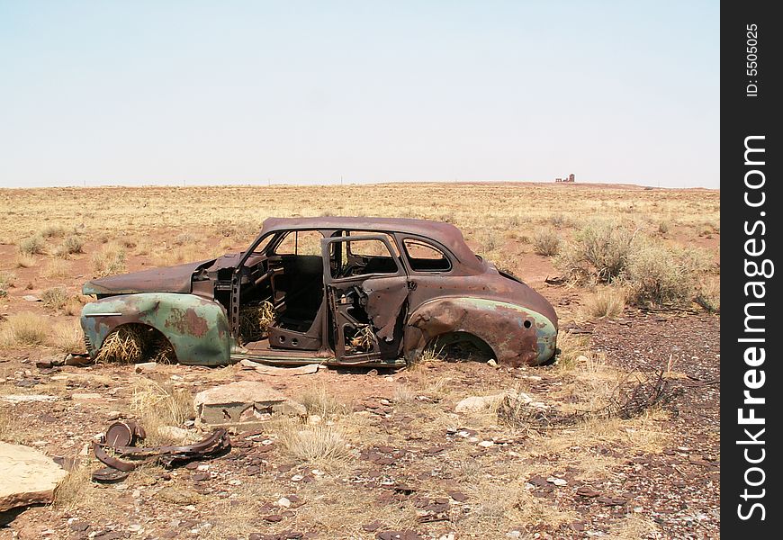 Rusted car sitting in desert. Rusted car sitting in desert