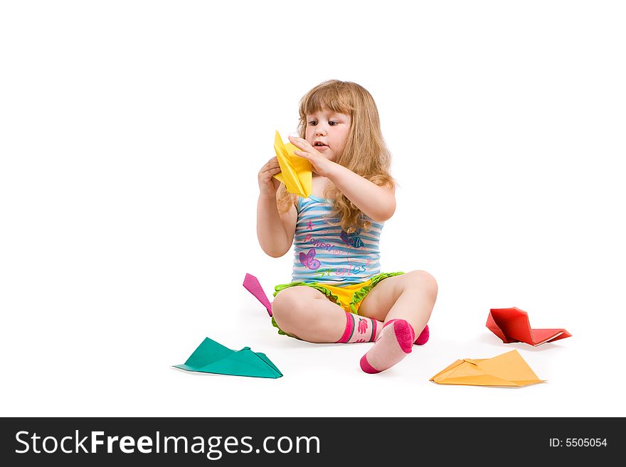 Baby playing with made-hands paper airplane. Baby playing with made-hands paper airplane