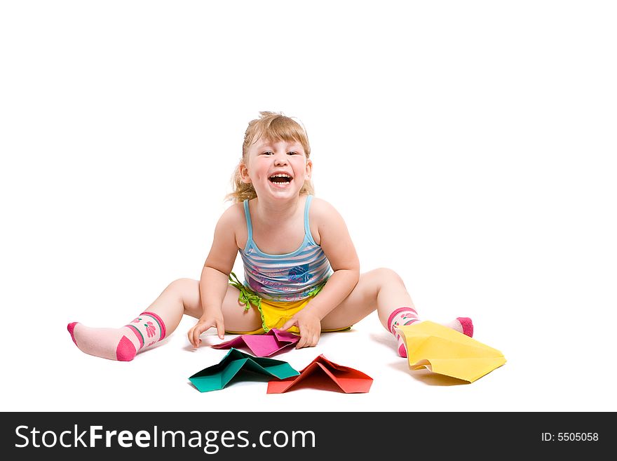 Baby playing with made-hands paper airplane and very happy from her work. Baby playing with made-hands paper airplane and very happy from her work