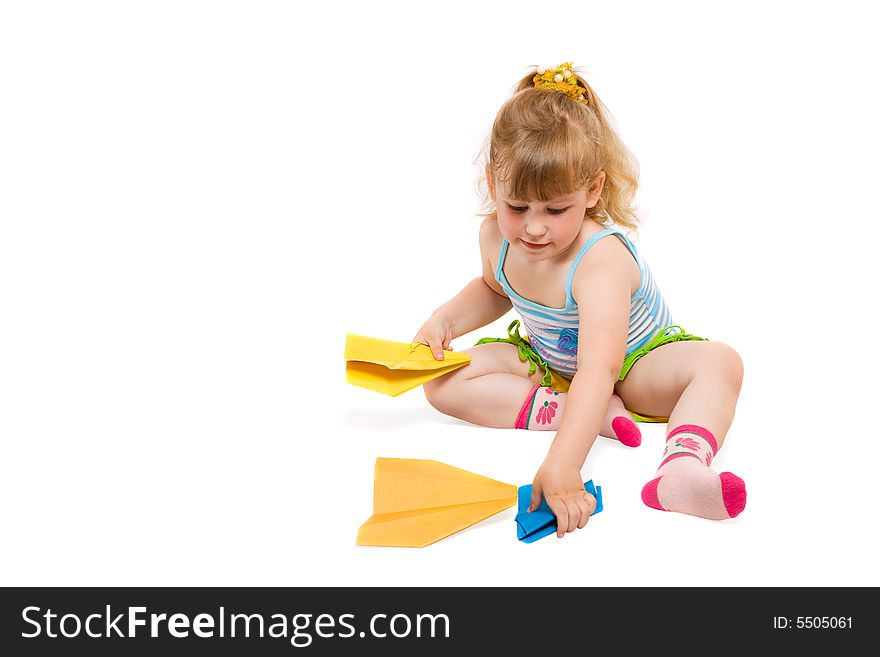 Small baby plaing with paper airplane made hands. Small baby plaing with paper airplane made hands