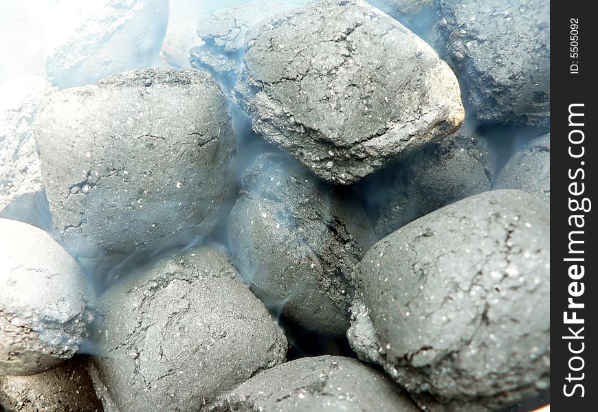 Close up view of smoldering charcoal for use in a barbecue grill. Close up view of smoldering charcoal for use in a barbecue grill.