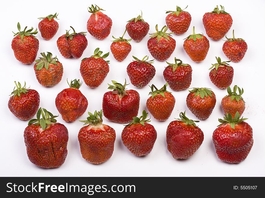 A lot of strawberries on white background. A lot of strawberries on white background