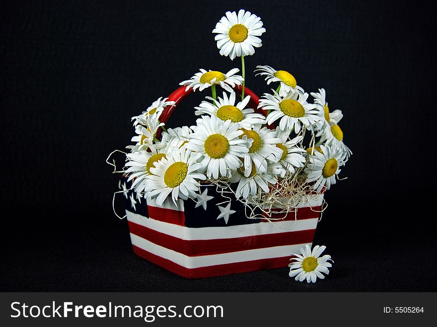 Bouquet of wild daisies in a flag basket. Bouquet of wild daisies in a flag basket.