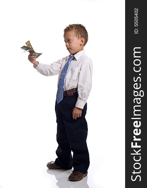 Young boy dressed as businessman holds money