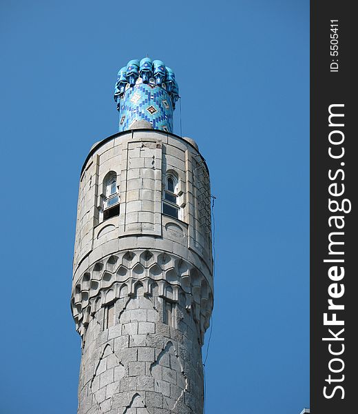 The minarets of St. Petersburg's cathedral mosque on the blue sky background. The minarets of St. Petersburg's cathedral mosque on the blue sky background