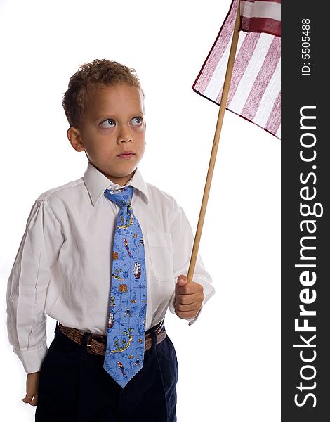 Young boy dressed as businessman with american flag - isolated on white. Young boy dressed as businessman with american flag - isolated on white