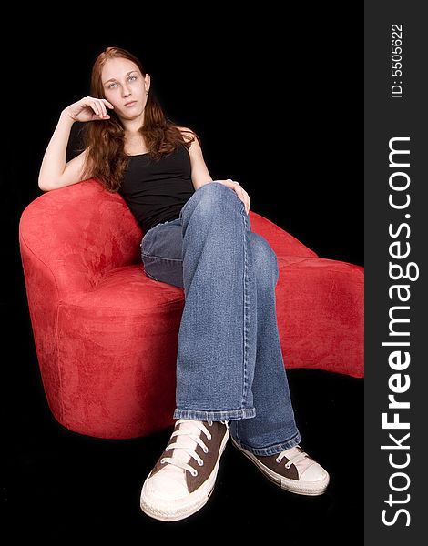 Extreme wide angle shot of redhead seated, legs look long due to angle. Extreme wide angle shot of redhead seated, legs look long due to angle