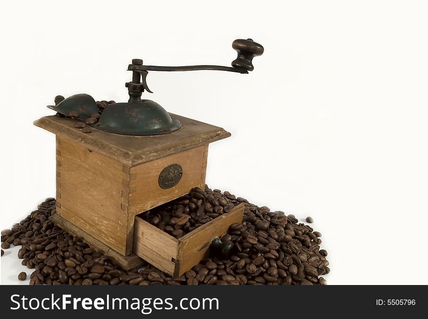 Old coffee mill with beans