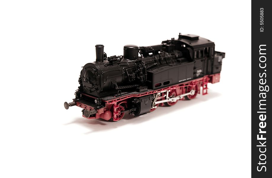A model of a steam engine on white background