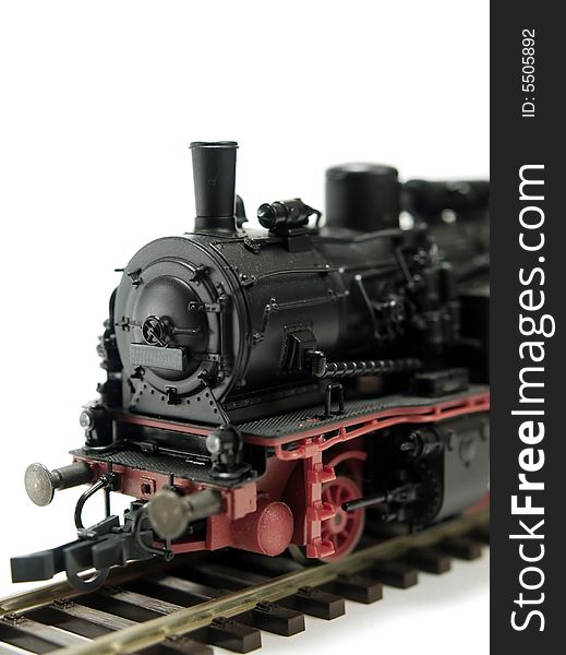 A model of a steam engine on white background