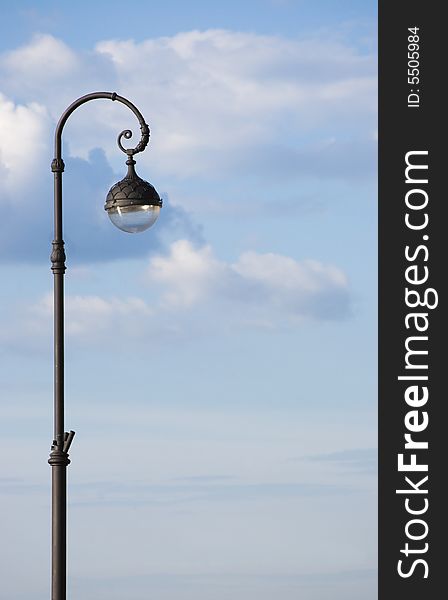 Classic style lantern on sky background.