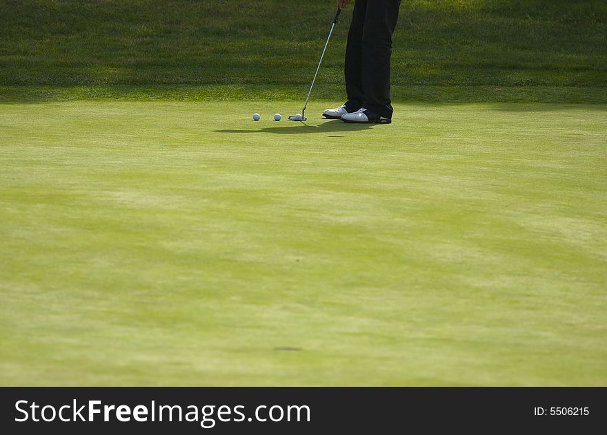 Golfer Putting on the Green one Summer Day. Golfer Putting on the Green one Summer Day.