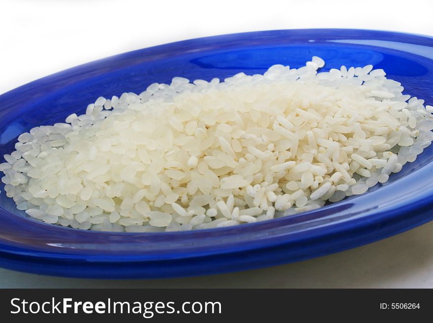 Rice on shiny blue plate