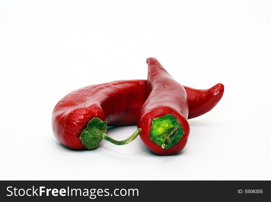 Hot red chili peppers on white background
