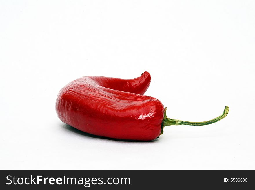 Hot red chili pepper on white background