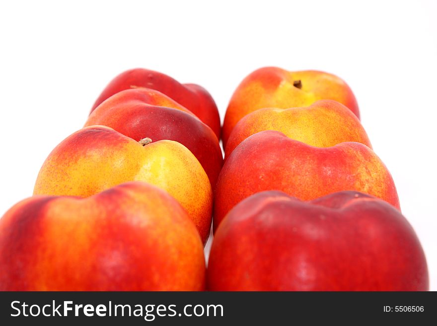 Juicy peaches on white background