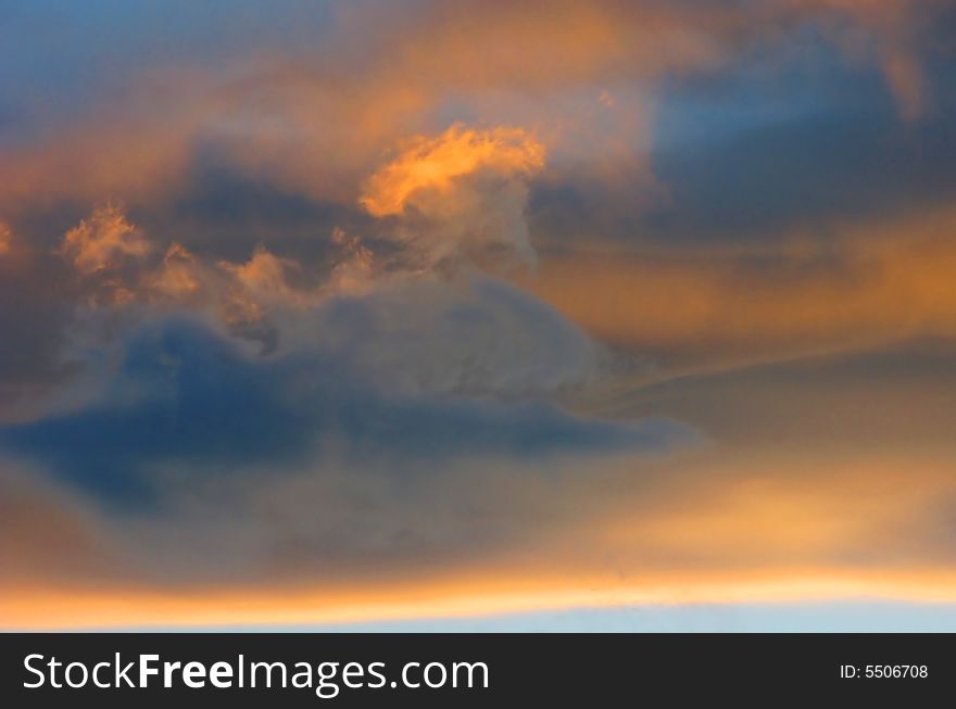 Setting sun has given the cloud formation a gentle and soothing texture and color. Setting sun has given the cloud formation a gentle and soothing texture and color