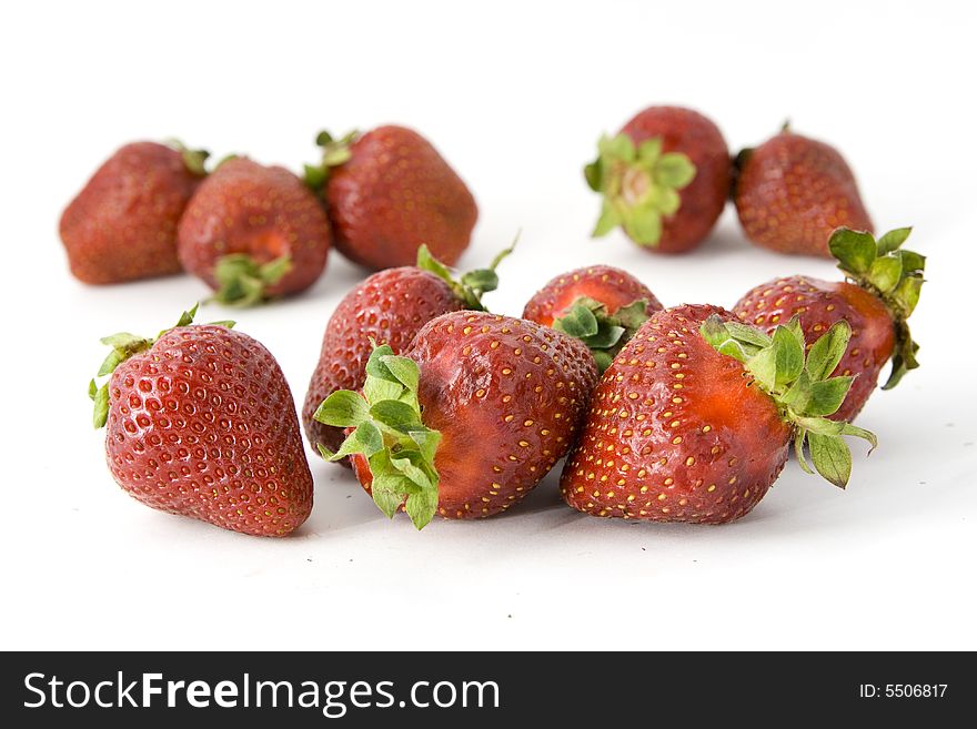 Some sweet strawberries isolated on white