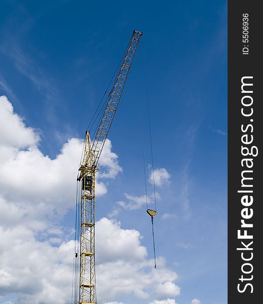 The elevating crane and blue sky
