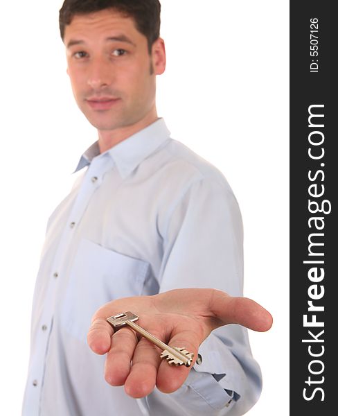 Businessman showing a key of a new house. Businessman showing a key of a new house